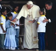 Pope giving out Child's Bible in Brazil