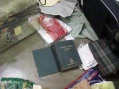 A bible on the floor of a devastated room at Boldipukur Miss