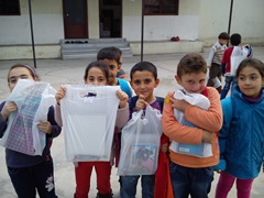 Children receiving aid in Syria