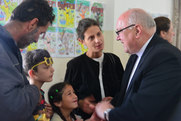 Father Halemba with refugees in Marmarita, Syria.2.jpg