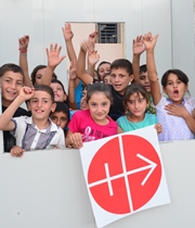 Iraq children with ACN sign