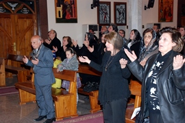 Prayer during Mass in Iraq