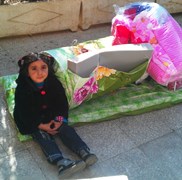 Syria_Homeless child in Damascus receives basic provisions
