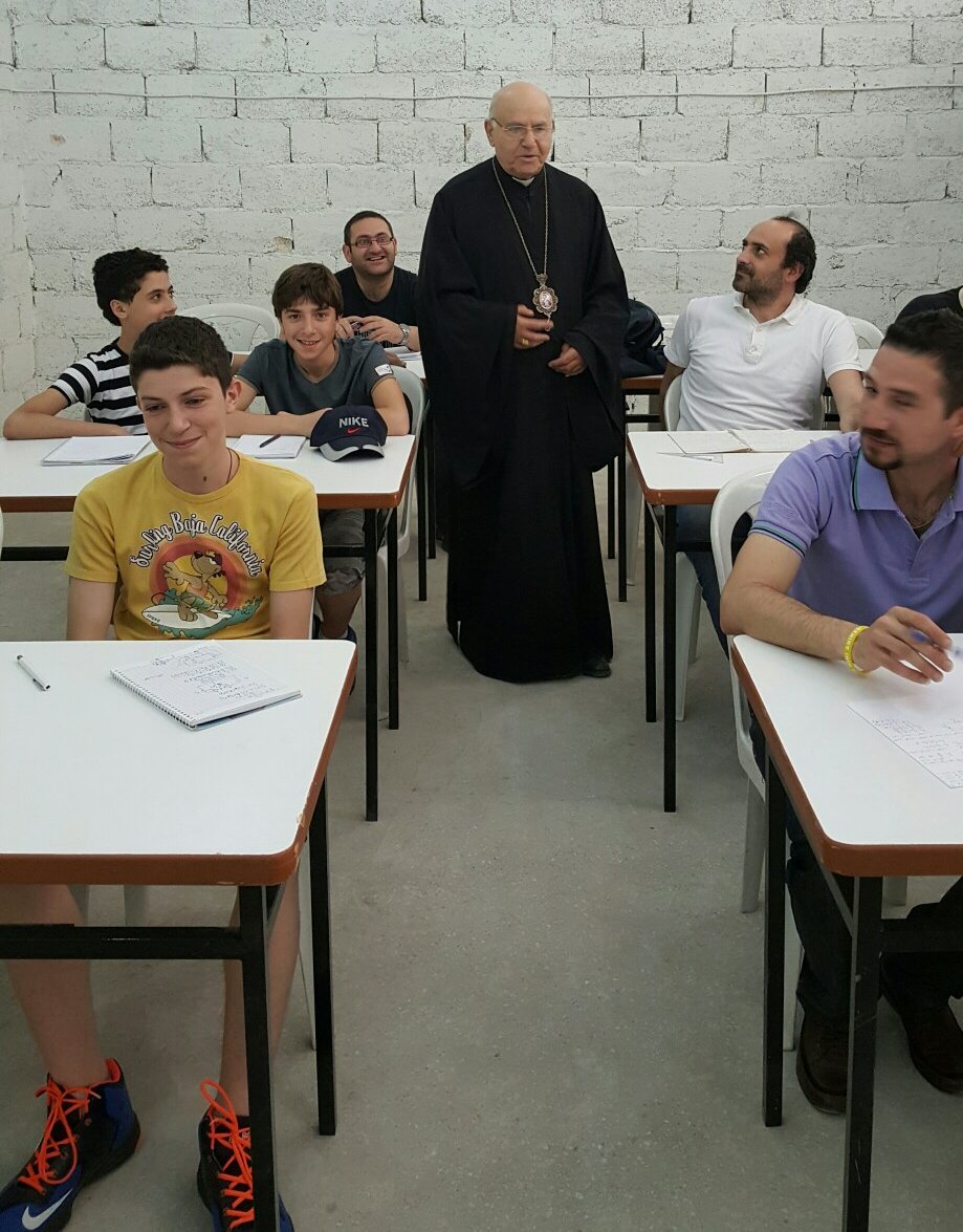 Archbishop Jeanbart greets trainees at the 'Buiild to Stay'