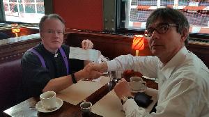 Father Kiely presents ACN with the first check